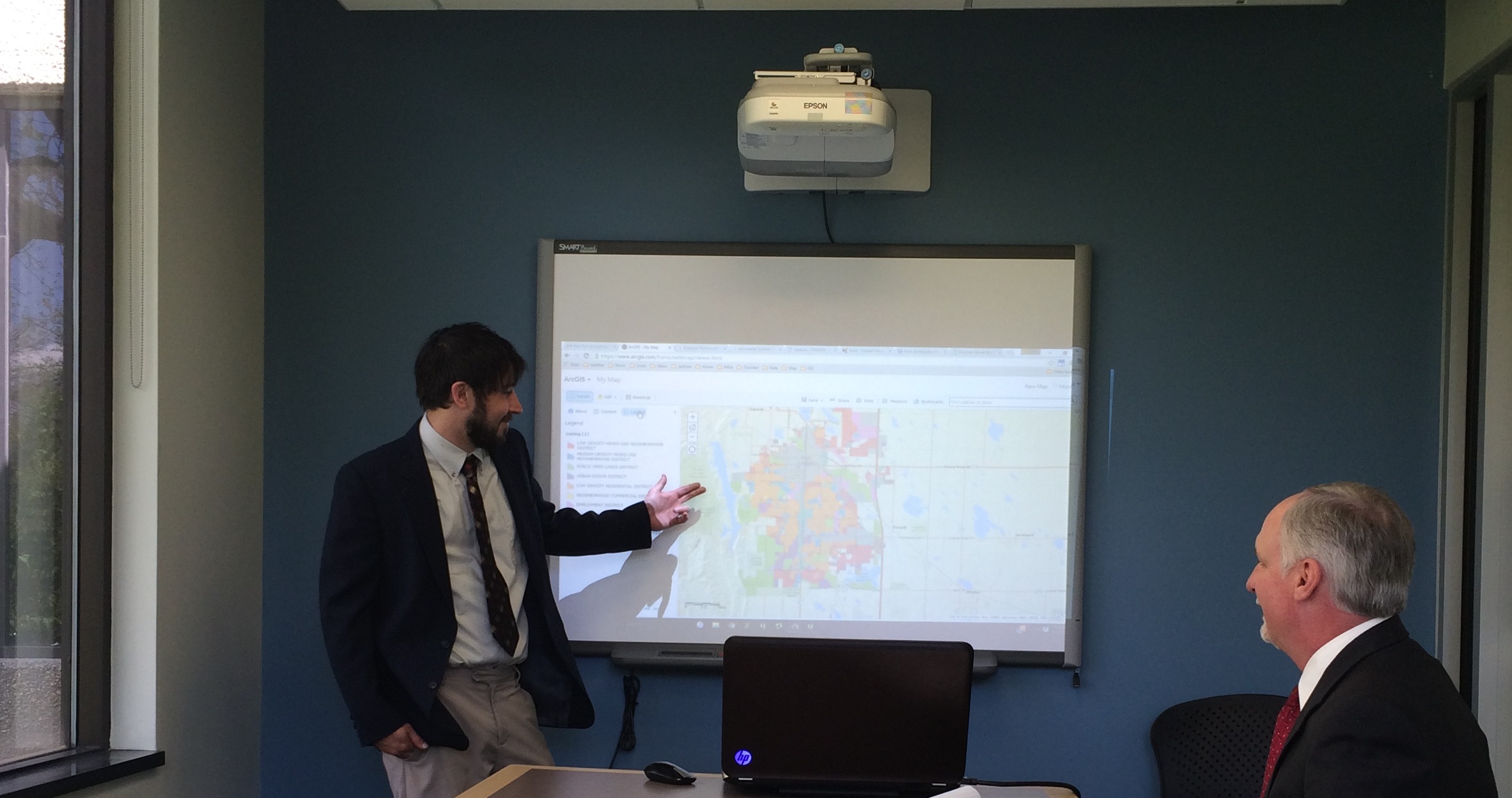 This photograph depicts Drew Derderian presenting a map assessment